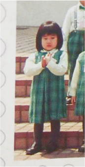 Old photo of Wing Pang as a toddler, wearing her kindergarten uniform in Hong Kong.
